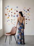 Asian woman wearing a bias‑cut slip‑style gown with a fluid, body‑skimming drape, slender adjustable straps, and a minimalist skinny scarf. The dress is unlined for a weightless feel. Model is 176 cm (5’9”) and wearing a size 2.